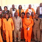 Caption; MEC Manzini (Third from right) standing alongside the Spray Operators to be deployed in three Local Municipalities