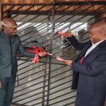 Caption; Premier Ndlovu(right) cutting the ribbon alongside Inkosi Mthethwa to officially open the new offices