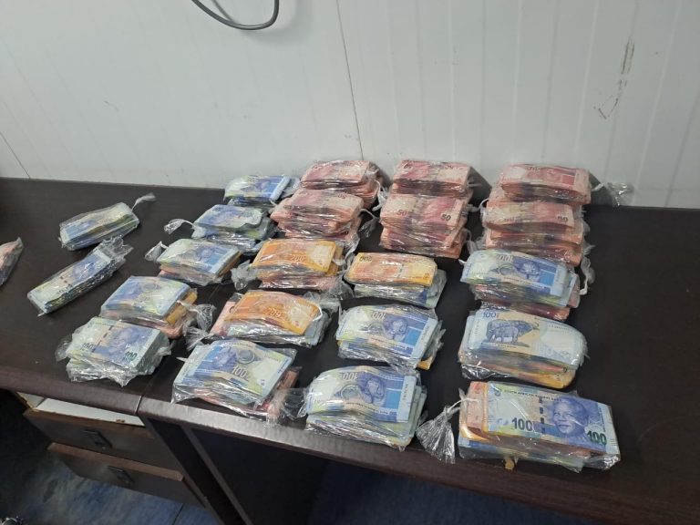 Caption; The R428,800 cash notes allegedly found in the suspect's possession