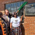 Education MEC Cathy Dlamini reading the plaque