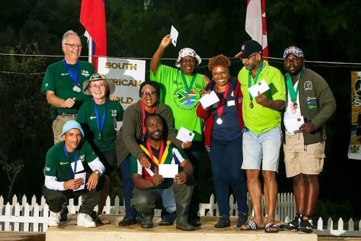 Caption; Winners displaying their medals